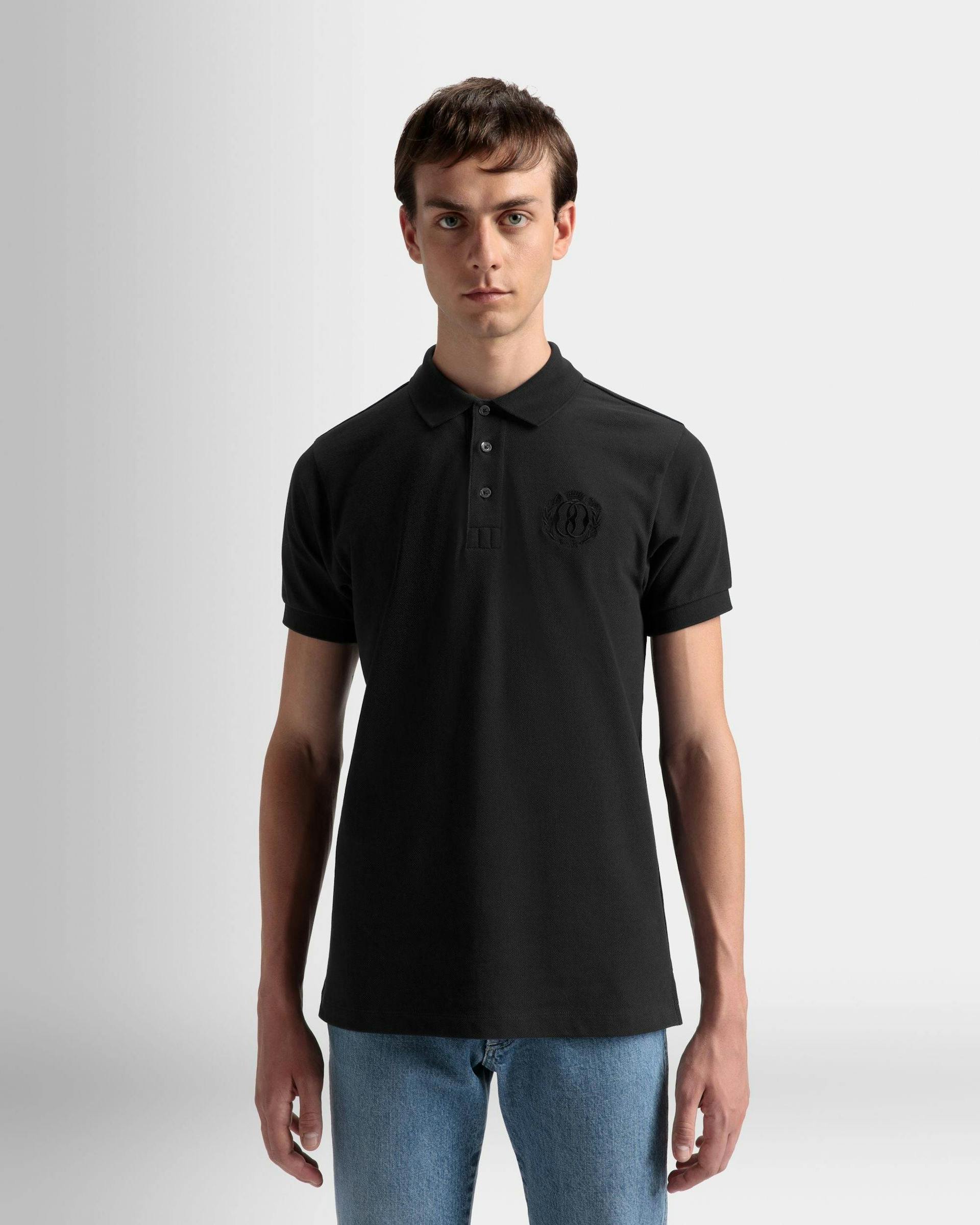 Men's Emblem Polo In Black Cotton | Bally | On Model Close Up