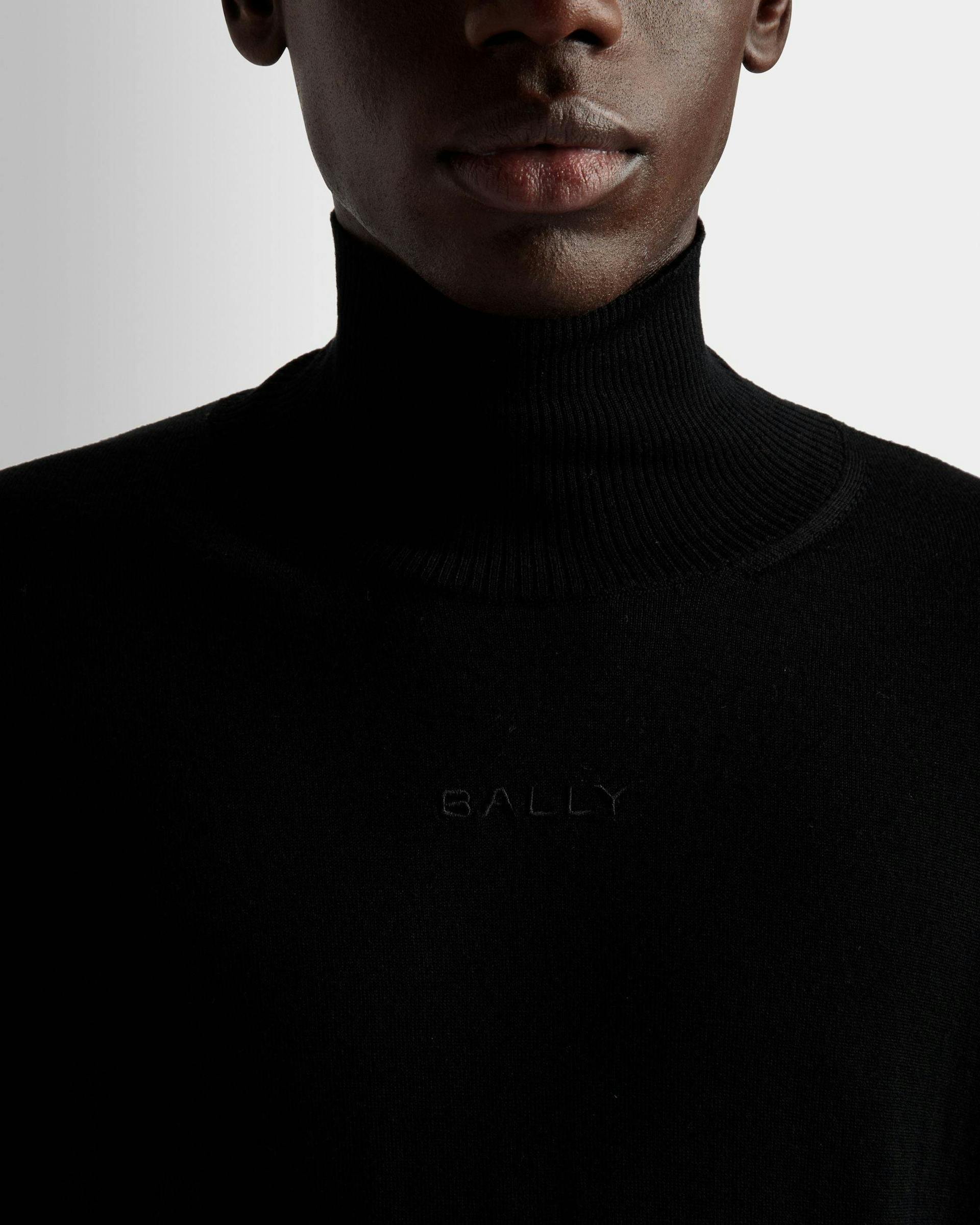 Men's Roll Neck Sweater In Black Wool | Bally | On Model Detail